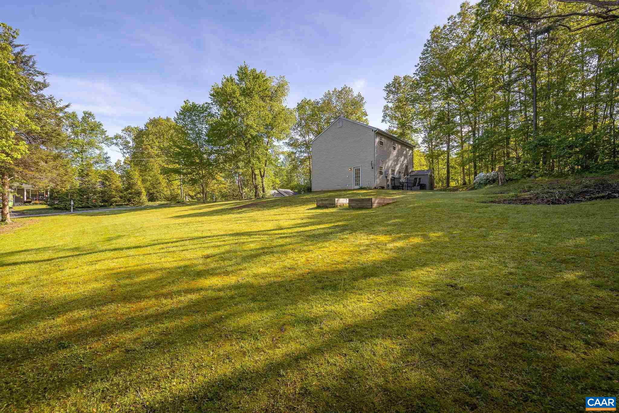 326 Geranium Road Ruckersville, VA 22968 - Photo 7 of 48 a big yard with large trees
