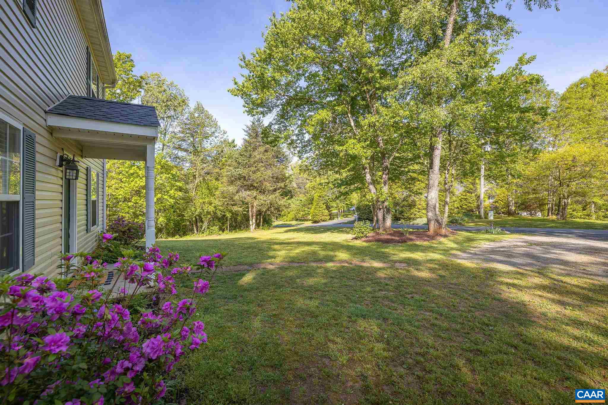 326 Geranium Road Ruckersville, VA 22968 - Photo 10 of 48 a view of a house with a big yard and fountain