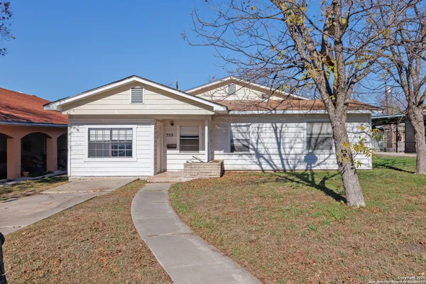 front view of a house with a yard