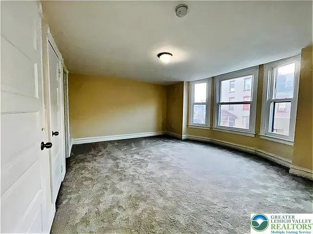 an empty room with windows