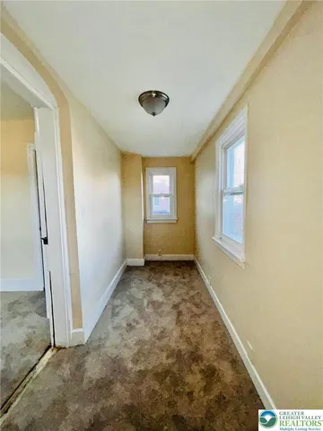 a view of an empty room and window