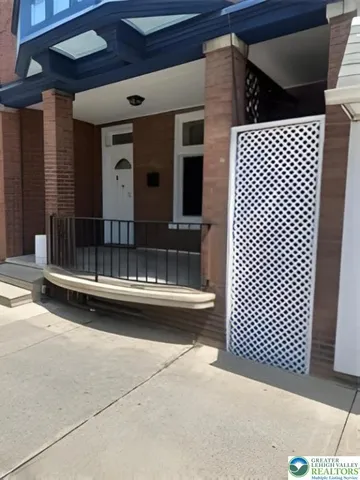 a view of barbeque grill with wooden floor