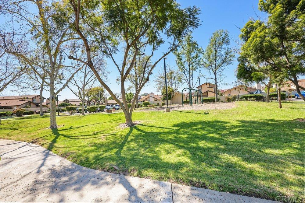 10385 Seth Way Santee, CA 92071 - Photo 3 of 33 a view of yard with swimming pool and trees