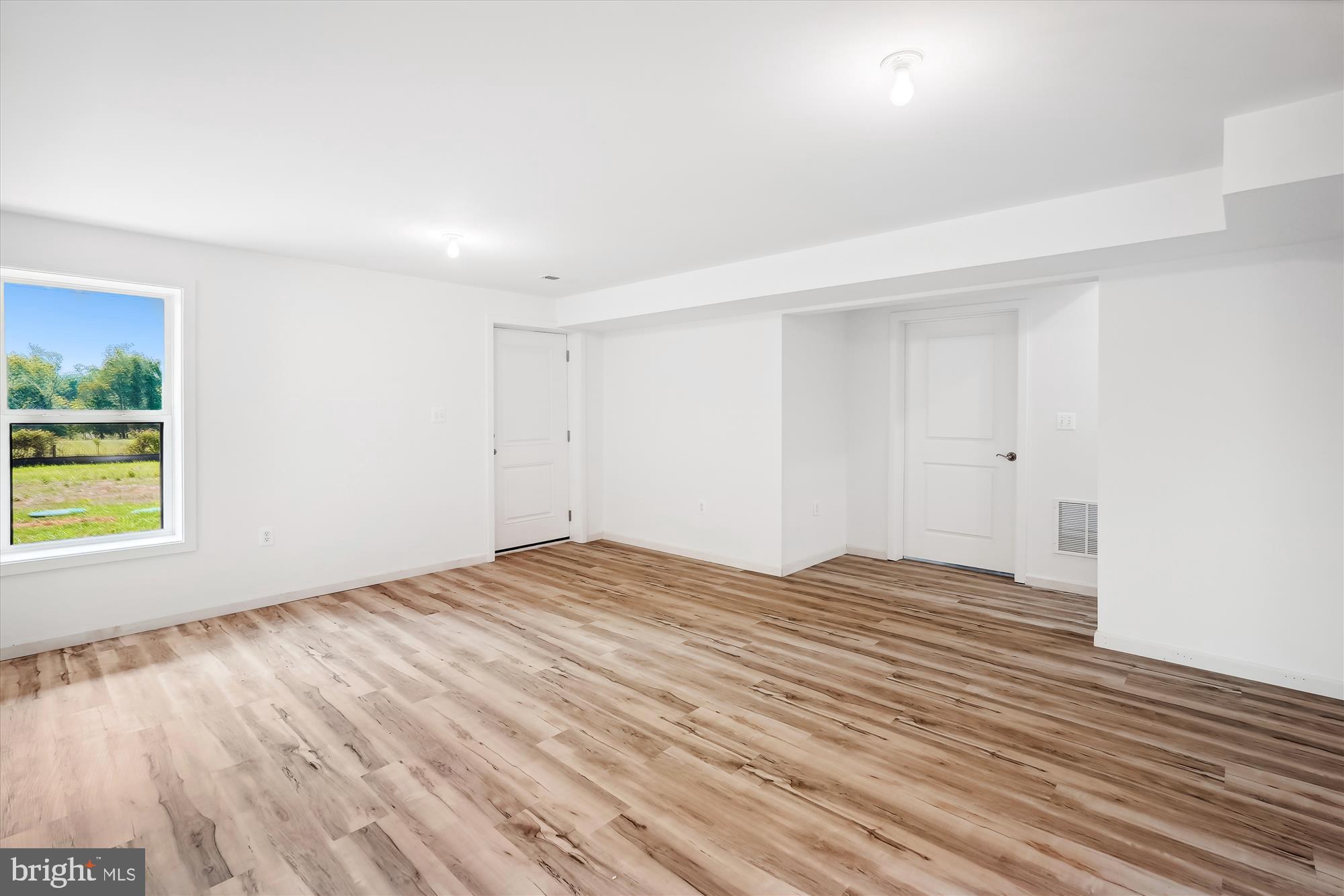 2 Cedar Ridge Road Rapidan, VA 22733 - Photo 57 of 60 a view of empty room with wooden floor and window
