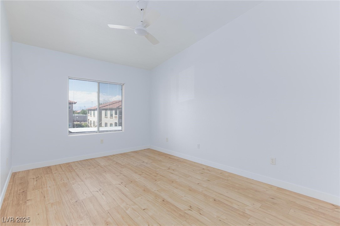 2305 West Horizon Ridge Parkway, Unit 1822 Henderson, NV 89052 - Photo 16 of 34 Spare room with light wood-style flooring and a ceiling fan