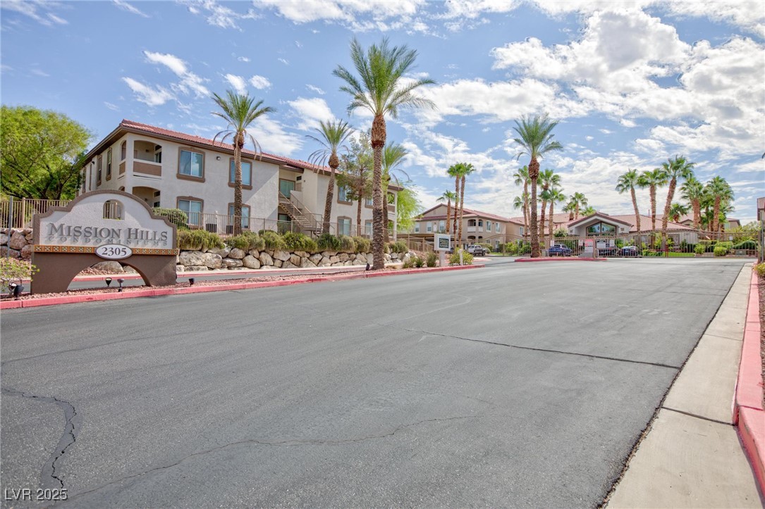 2305 West Horizon Ridge Parkway, Unit 1822 Henderson, NV 89052 - Photo 2 of 34 View of asphalt road with curbs, a residential view, and sidewalks