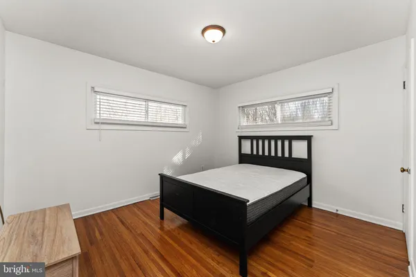a bed room with a bed and a window