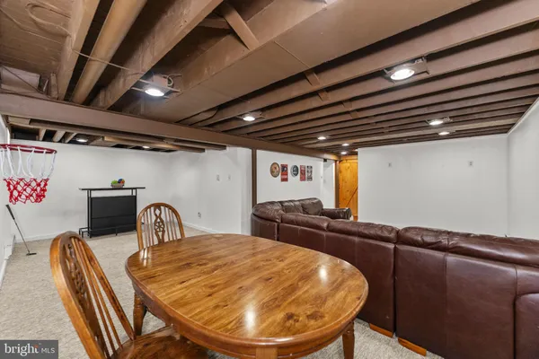 a view of a kitchen with a table and chairs