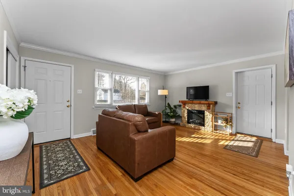 a living room with furniture fireplace and flat screen tv