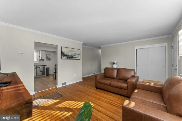 a bedroom with furniture and a rug