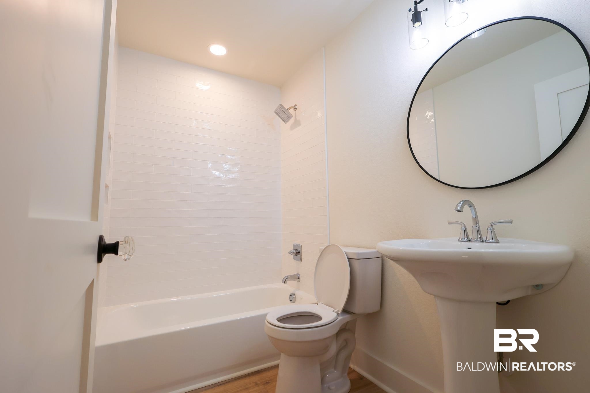 12190 Pecan Grove Street Magnolia Springs, AL 36555 - Photo 11 of 45 Bathroom featuring hardwood / wood-style floors, shower / washtub combination, and toilet