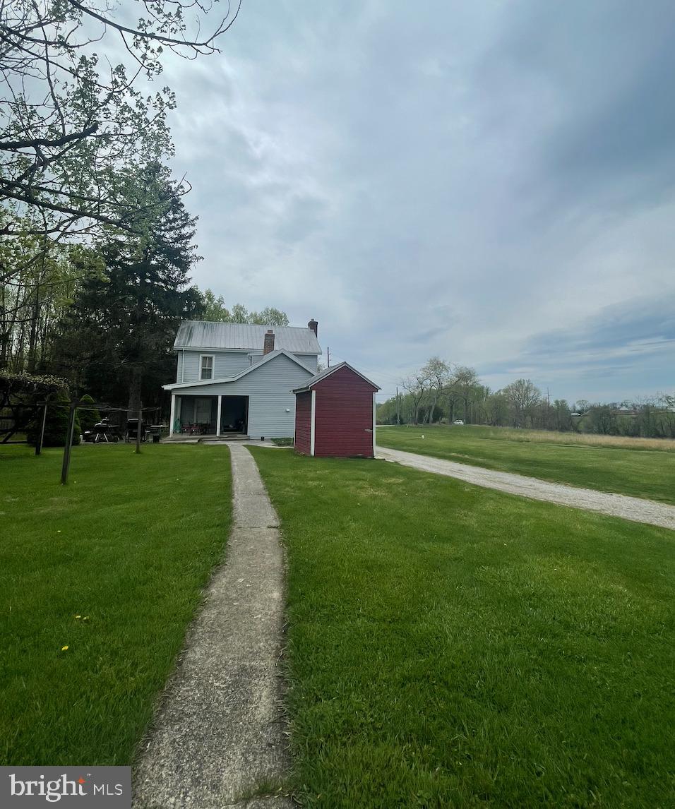 21006 Boonsboro Mountain Road Boonsboro, MD 21713 - Photo 2 of 9 a front view of a house with garden