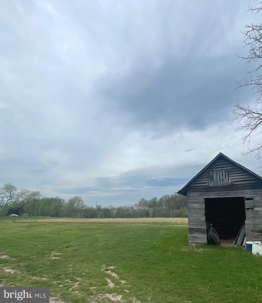 21006 Boonsboro Mountain Road Boonsboro, MD 21713 - Photo 3 of 9 a front view of a house with a yard