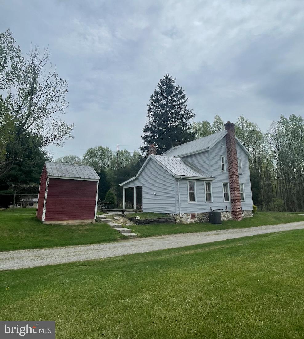 21006 Boonsboro Mountain Road Boonsboro, MD 21713 - Photo 4 of 9 a front view of house with yard and green space