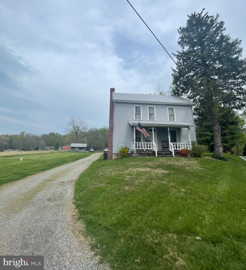 21006 Boonsboro Mountain Road Boonsboro, MD 21713 - Photo 5 of 9 a view of a house with a big yard and large trees