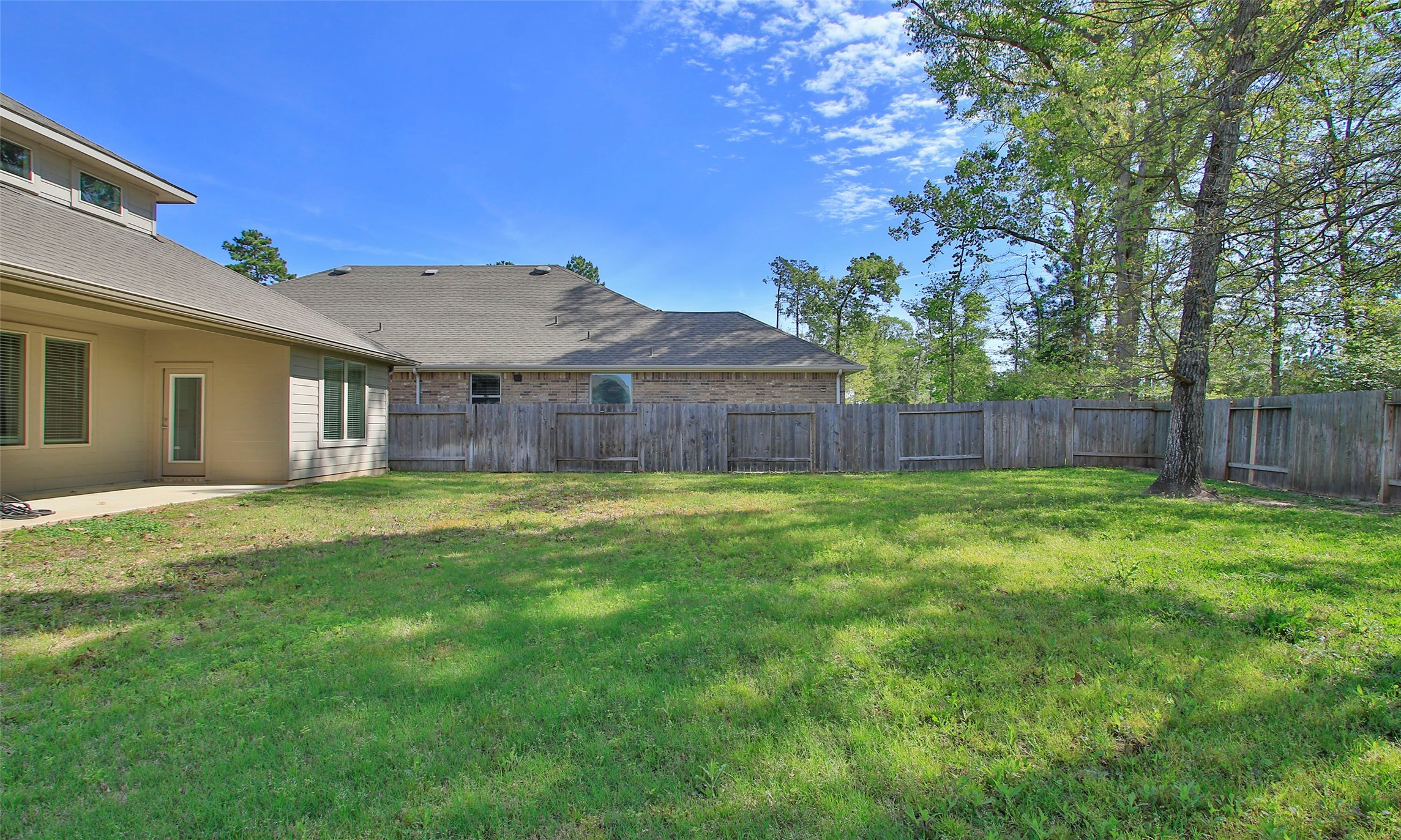 14120 Sand Ridge Court Conroe, TX 77384 - Photo 41 of 43 a front view of a house with a garden