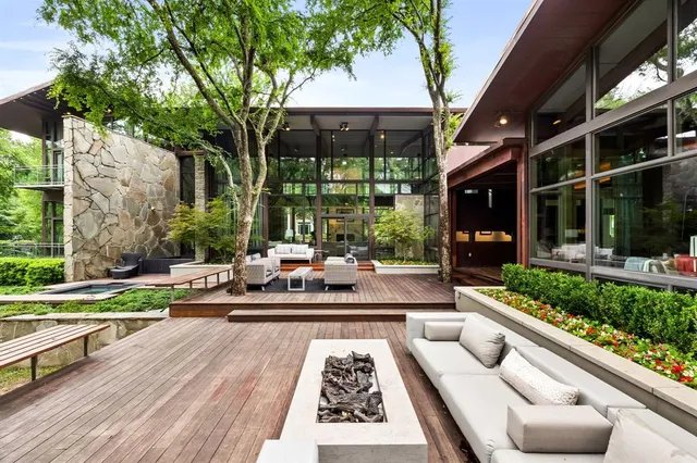 a view of swimming pool with outdoor seating and a patio