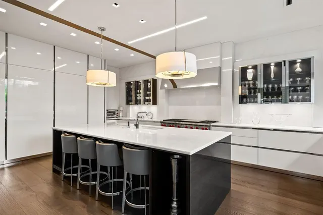 a kitchen with a table and chairs in it