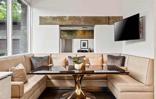 a view of living room with furniture and a flat screen tv