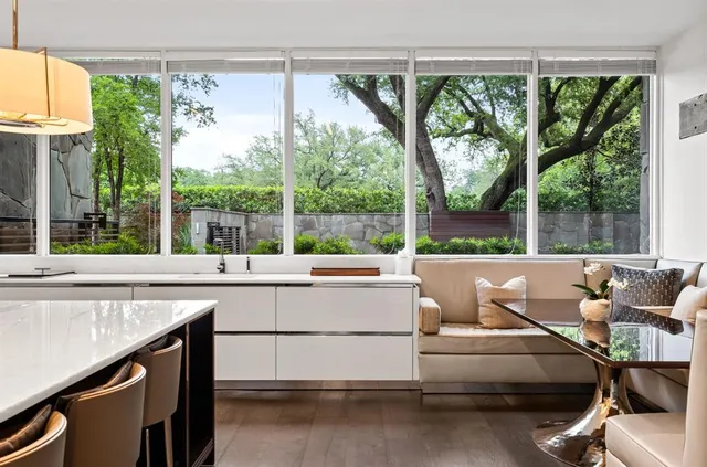 a living room with a table and chairs
