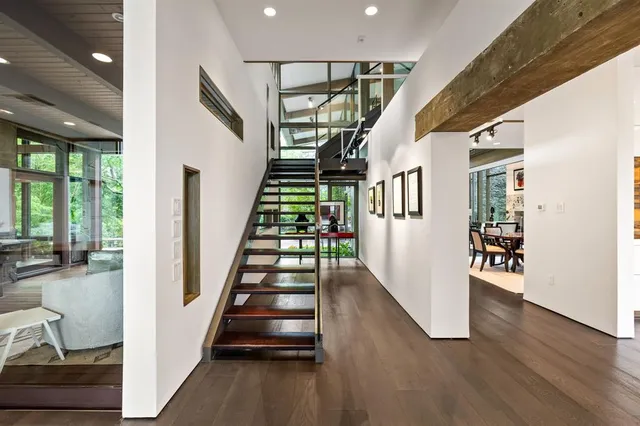 a view of an entryway with wooden floor and stairs