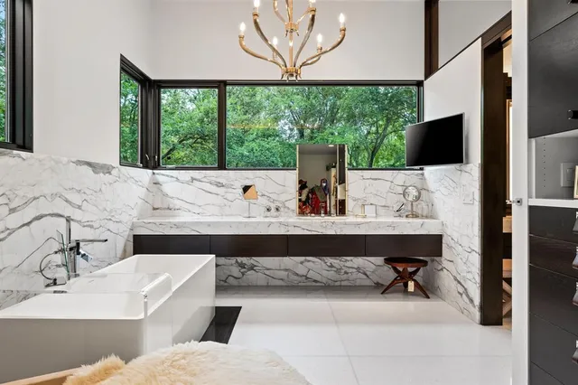 a living room with a large window and a table