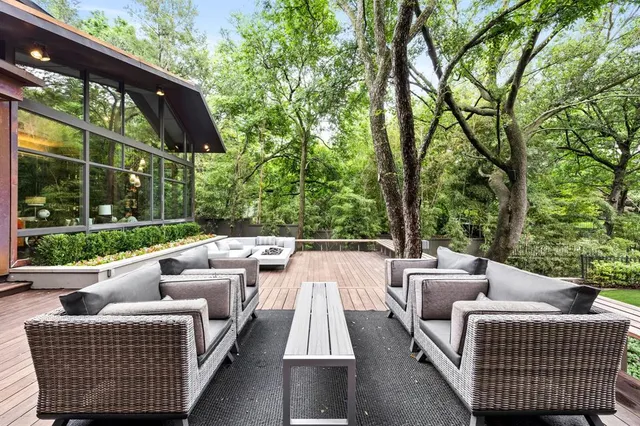 a view of patio with couches and pool