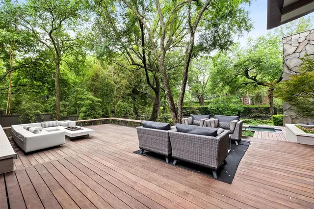 a view of a patio with couches and potted plants