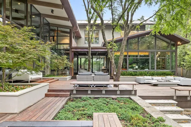 a living room with patio furniture and a yard