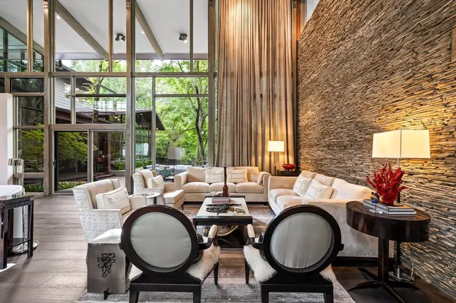 a dining room with furniture and a window