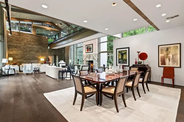 a dining room with furniture and wooden floor