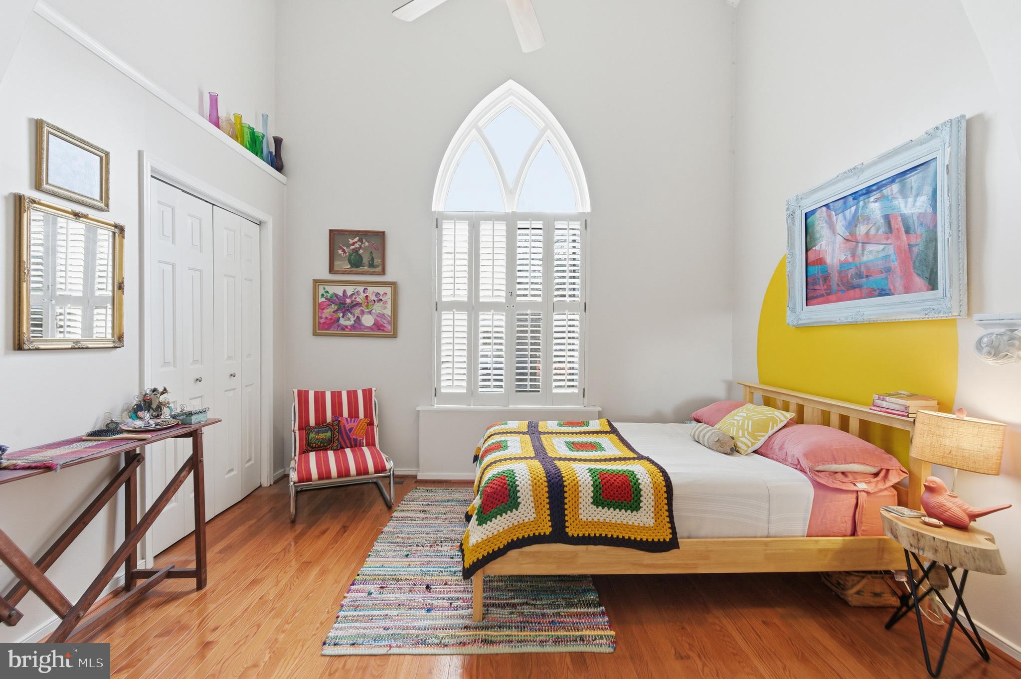 122 West Henrietta Street, Unit 5 Baltimore, MD 21230 - Photo 3 of 31 a bedroom with a bed and wooden floor
