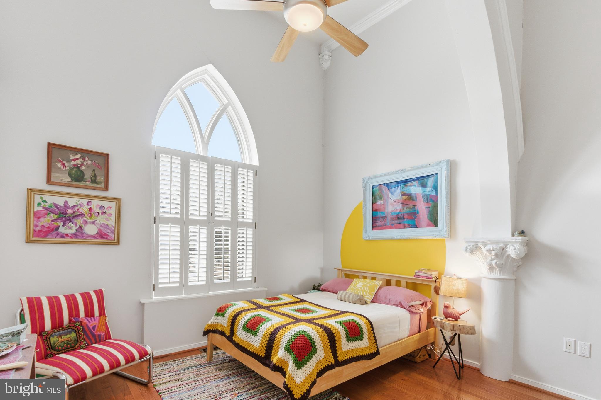 122 West Henrietta Street, Unit 5 Baltimore, MD 21230 - Photo 4 of 31 a bedroom with a bed and a painting on the wall