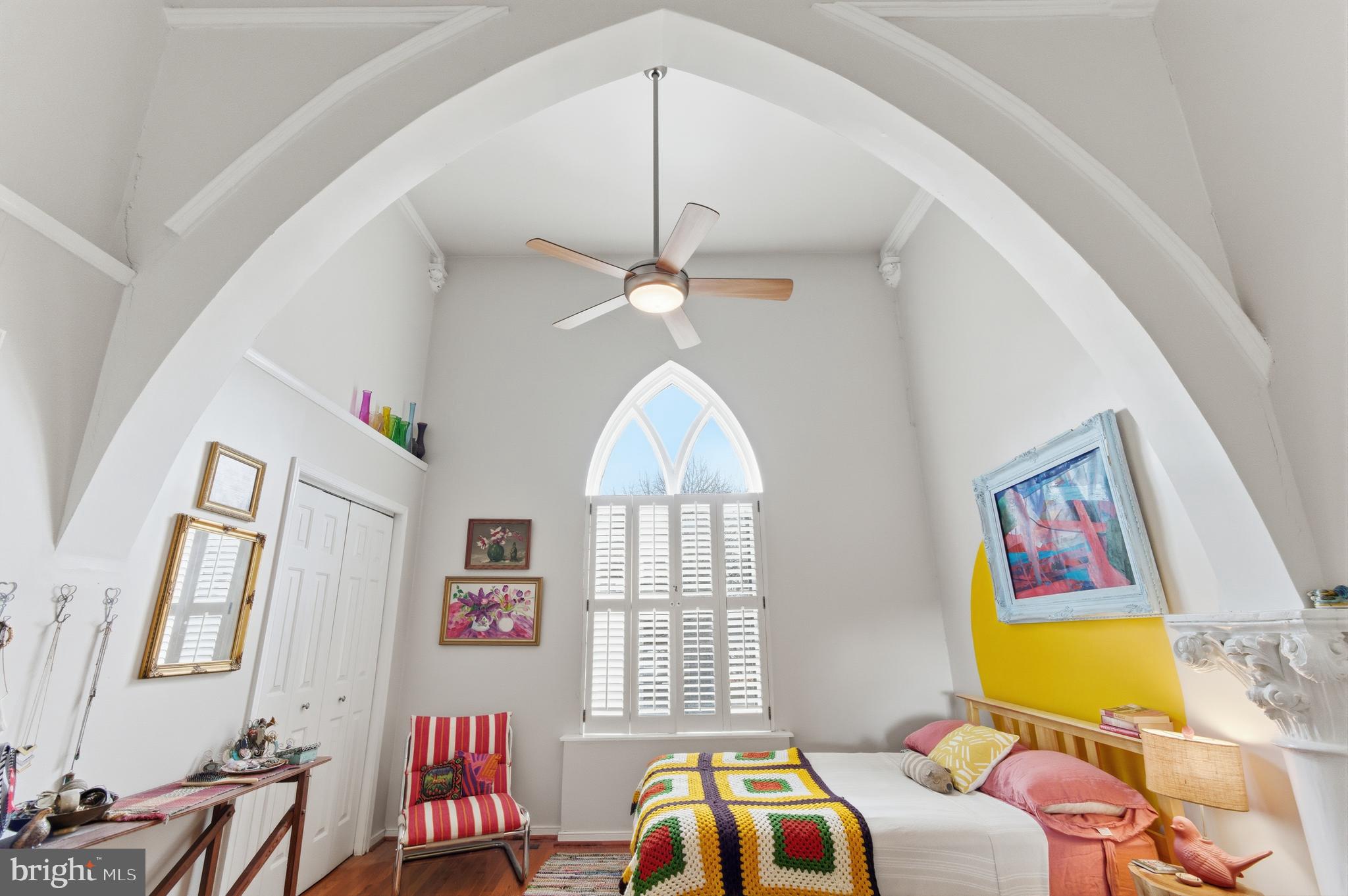 122 West Henrietta Street, Unit 5 Baltimore, MD 21230 - Photo 6 of 31 a bedroom with a bed a dresser next to a window