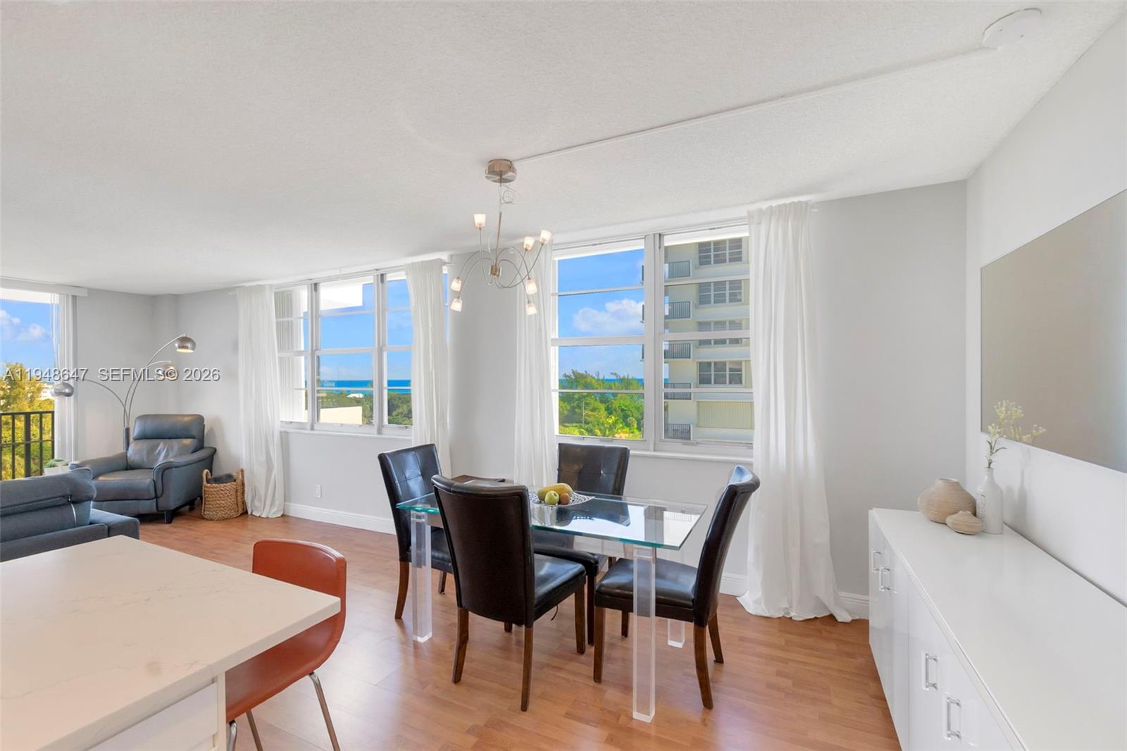 2121 North Ocean Boulevard, Unit 902W Boca Raton, FL 33431 - Photo 14 of 62 a view of a dining room with furniture window and outside view