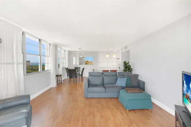 a living room with furniture and a table