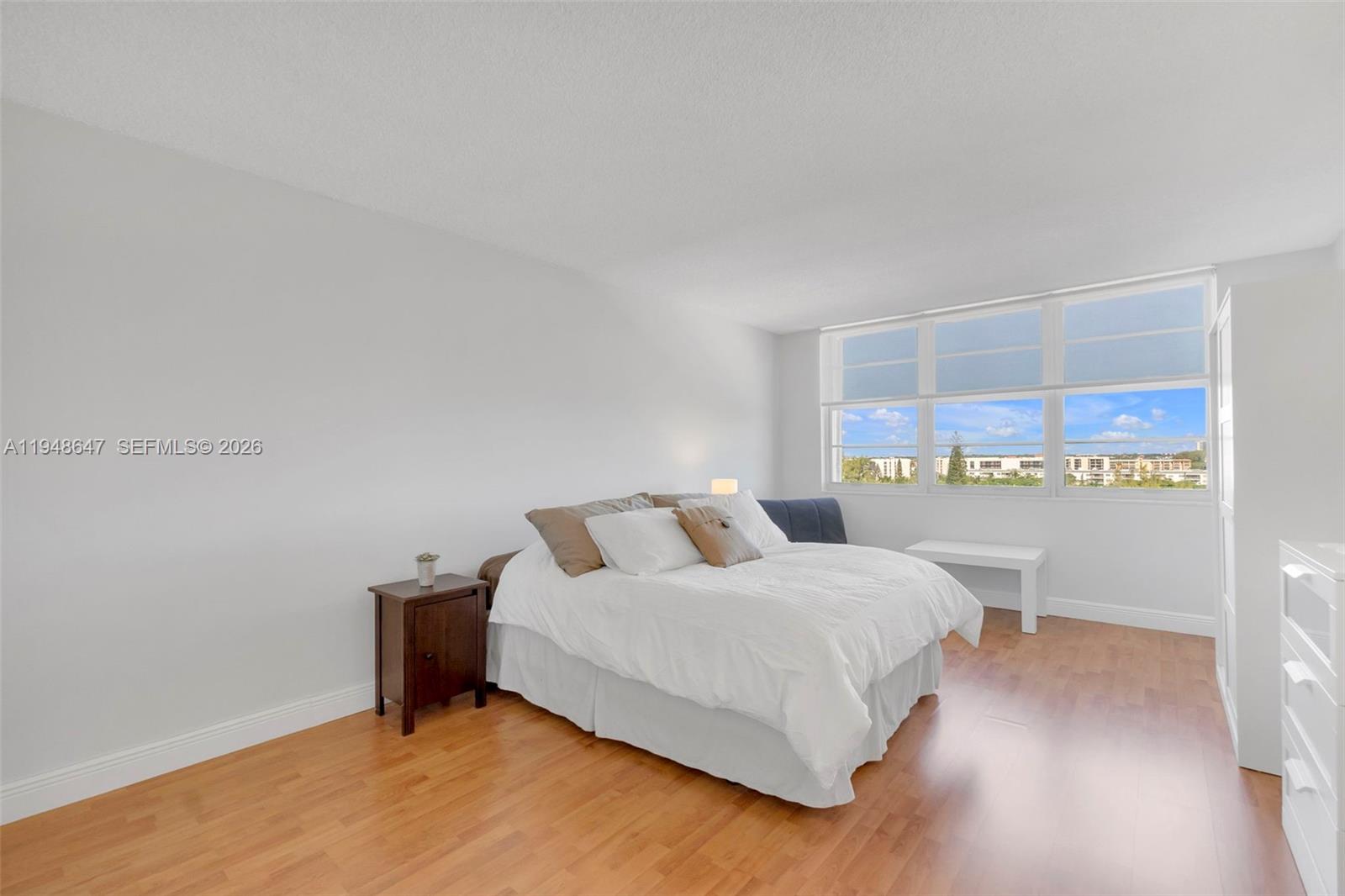 2121 North Ocean Boulevard, Unit 902W Boca Raton, FL 33431 - Photo 22 of 62 a bedroom with a bed and a table in it