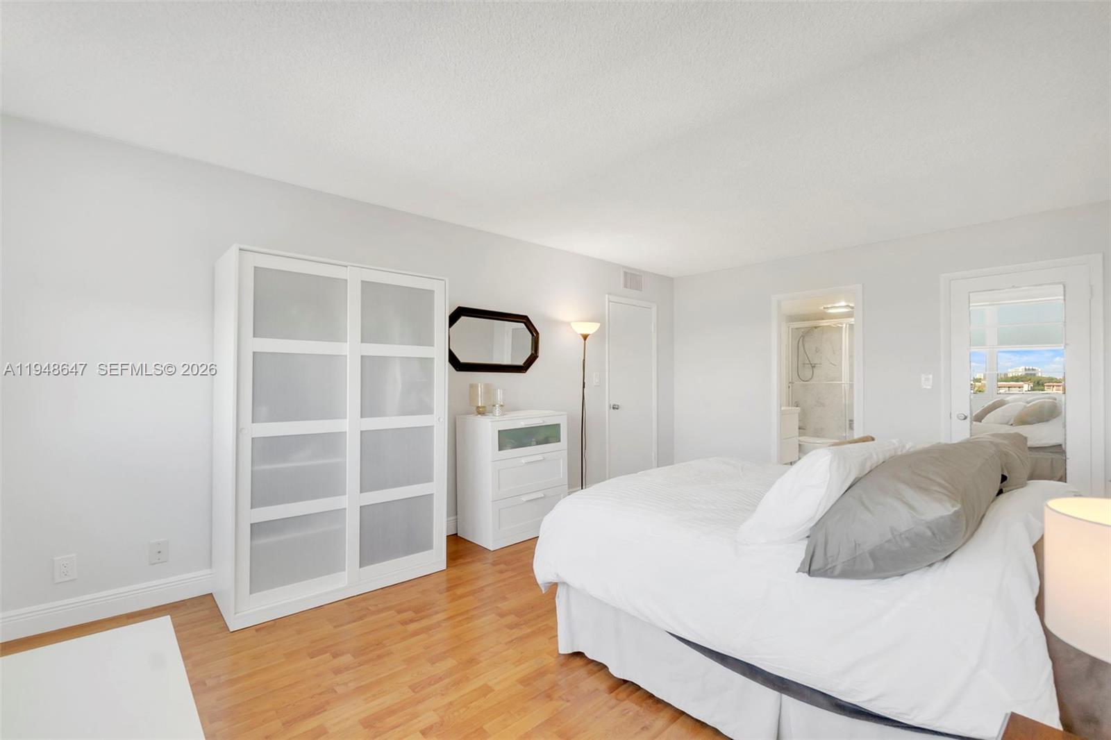 2121 North Ocean Boulevard, Unit 902W Boca Raton, FL 33431 - Photo 24 of 62 a bedroom with a bed and a window