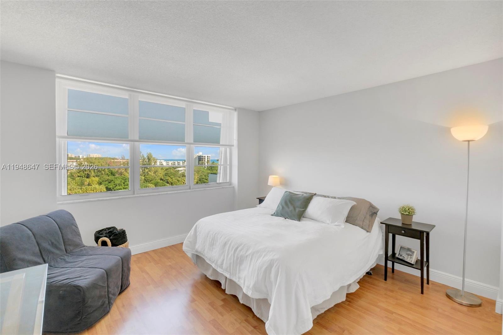 2121 North Ocean Boulevard, Unit 902W Boca Raton, FL 33431 - Photo 29 of 62 a bedroom with a bed and a window