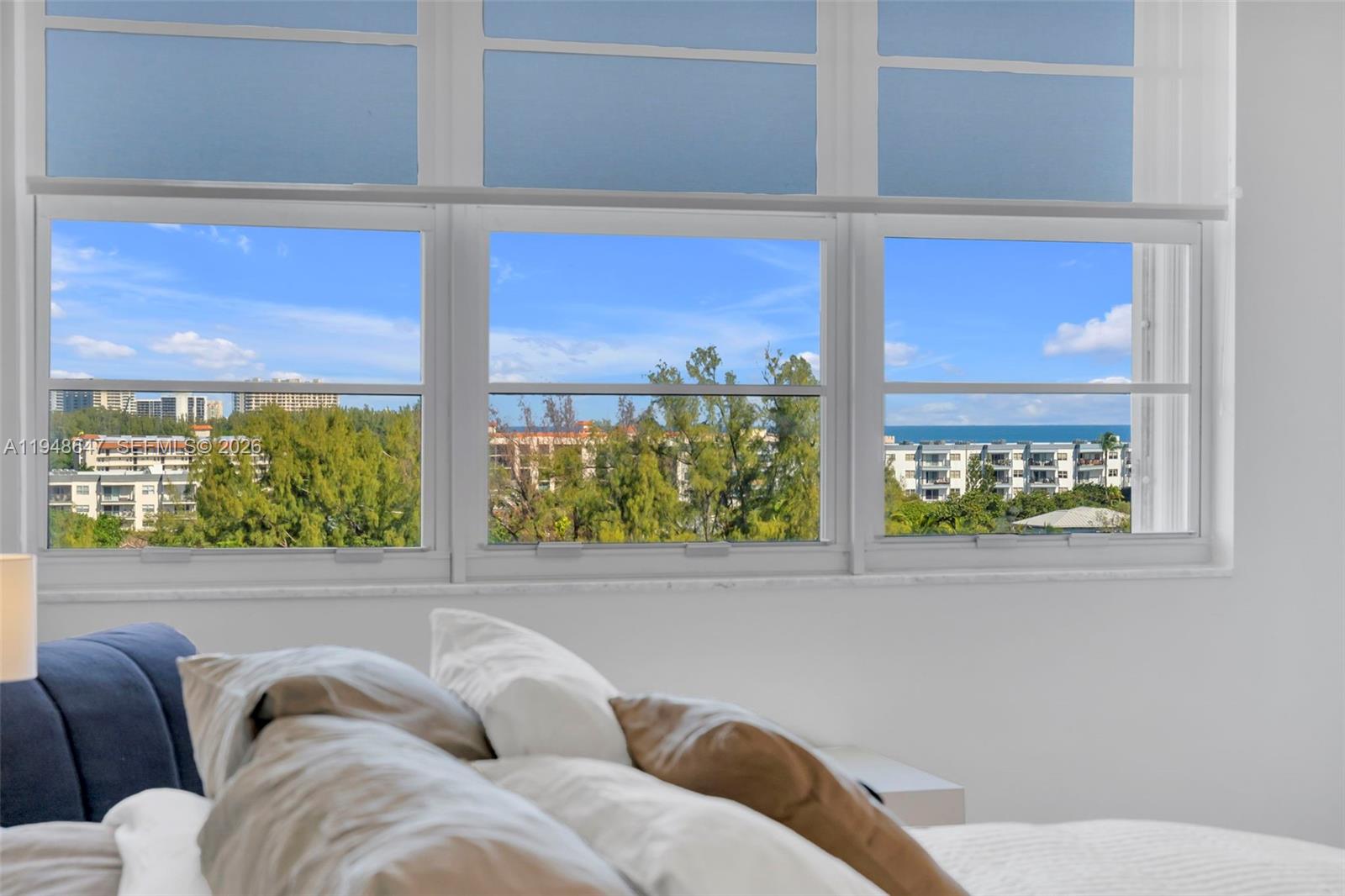 2121 North Ocean Boulevard, Unit 902W Boca Raton, FL 33431 - Photo 30 of 62 a living room with furniture and a window