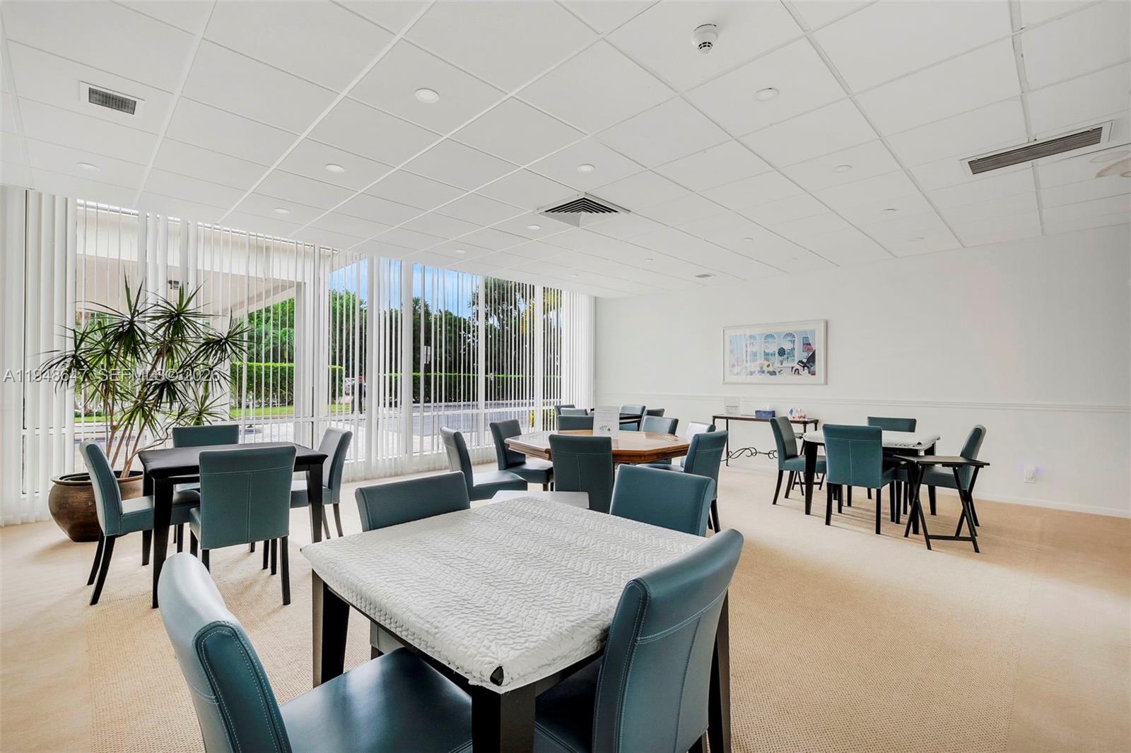 2121 North Ocean Boulevard, Unit 902W Boca Raton, FL 33431 - Photo 44 of 62 a view of a dining room with furniture window and outside view