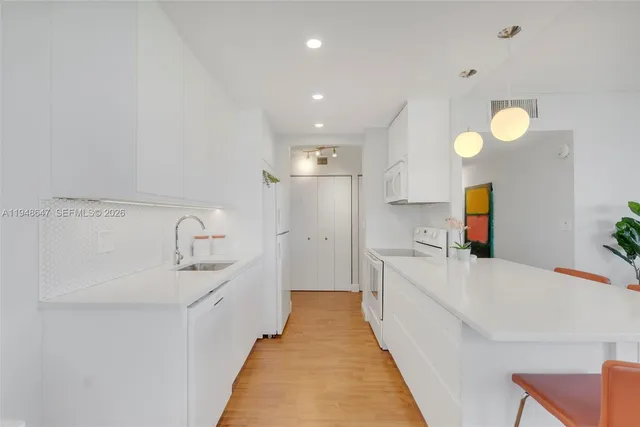 a view of a kitchen with a sink