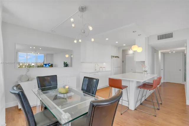 a dining room with a table and chairs