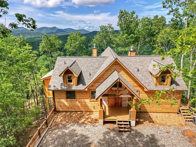 a blue white house with large windows