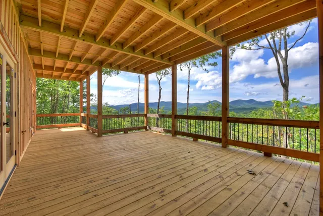 a view of a porch with wooden floor and outdoor space