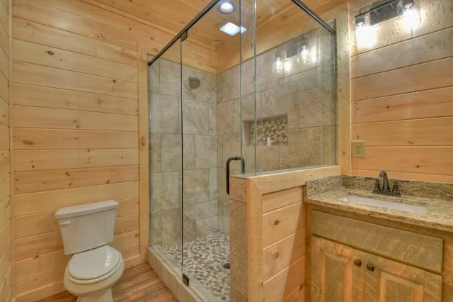 a view of a room with wooden floor and furniture