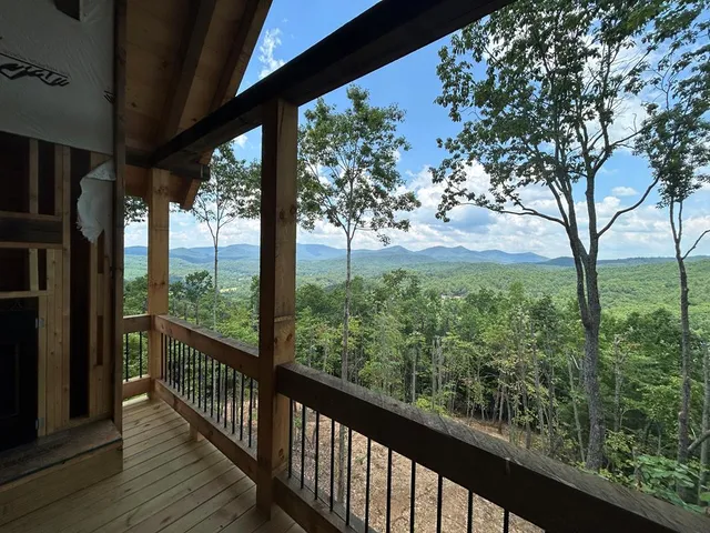 a view of a big yard with lots of green space