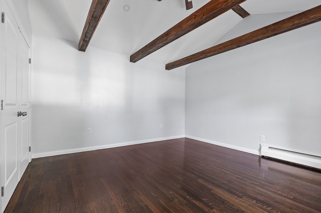 22 King Terrace Beverly, MA 01915 - Photo 14 of 28 a view of a room with wooden floor and white walls
