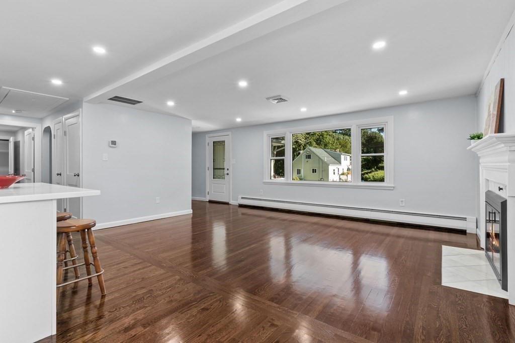 22 King Terrace Beverly, MA 01915 - Photo 9 of 28 a view of an empty room with wooden floor and a window