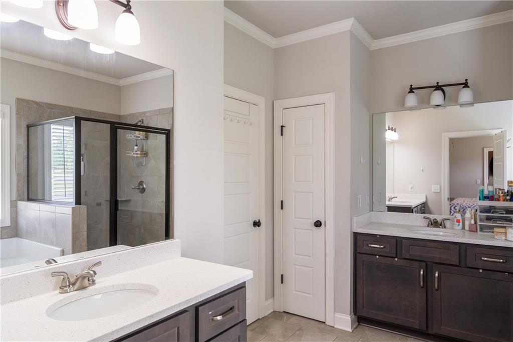 712 Fleeting Way Monroe, GA 30655 - Photo 16 of 29 a bathroom with a sink vanity and a mirror